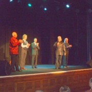 The five performers, receiving and giving applause